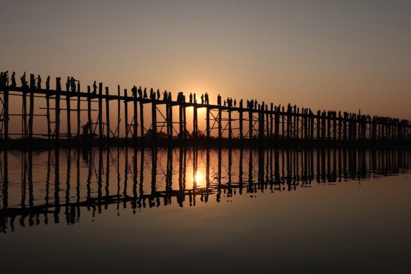 Sunset at the longest teak bridge in the world at Mandalay. Image: Tony Naake