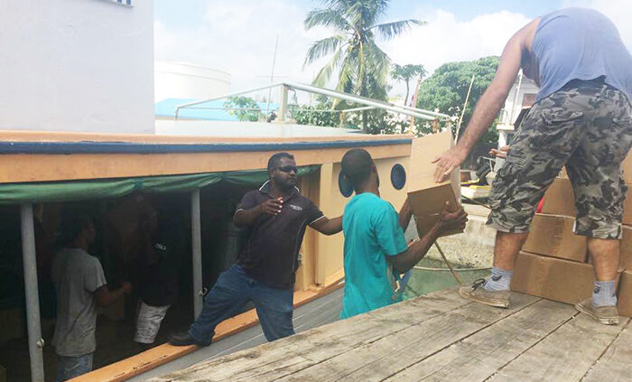 The Southern Cross being loaded with relief supplies. © Bob Wyllie, 2017. Used with permission