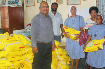 The Community of the sisters of the Church receiving their relief supplies.