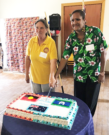 Cutting the cake at the Reconciliation Luncheon.