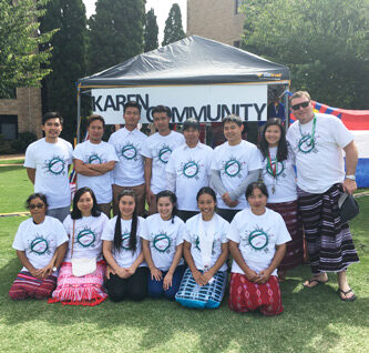 Snow (seated second from the left) with the Karen Community during the Trinity College multicultural event. © Nant Hnin Hnin Aye, 2017.