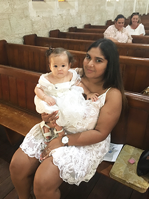 Gloria baptised this baby as part of her priestly ministry.