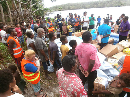 Bishop Patterson Worek formerly handing over the supplies to NDMO's Coordinator Philip Meto at Loh. © ACOM 2018