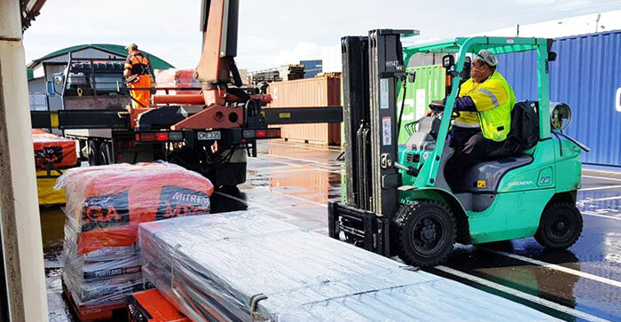 Loading supplies into the shipping containers. © Anglican Missions New Zealand. Used with permission.