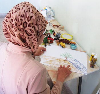 A student in a Psychosocial Support Art Therapy session. © ACT Alliance. Used with permission.