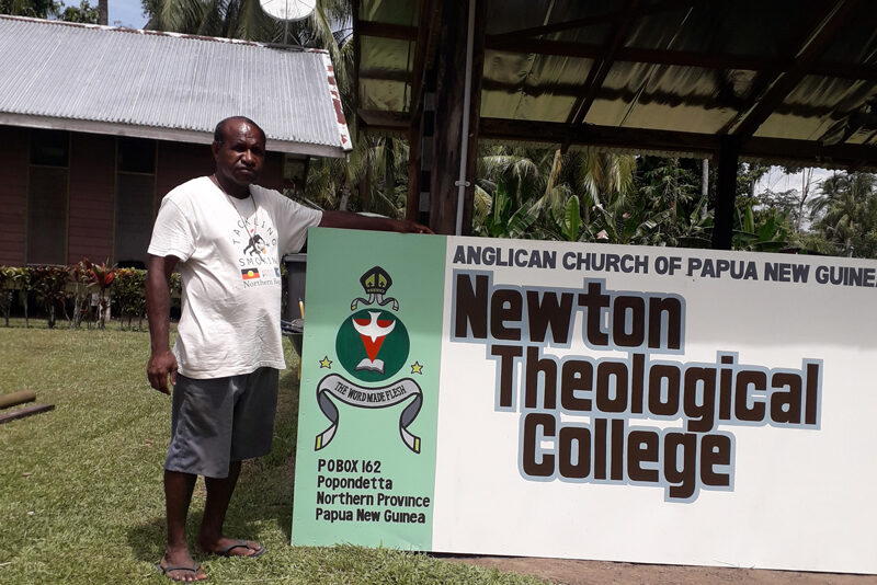 Fr Luscom Bera and Fr Giles Motisi, NTC lecturers sort through donated books with Larissa the librarian. © Bishop Jeffrey Driver, 2018.