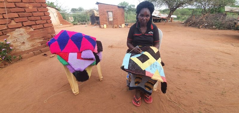 Veronicah crochets one of her best-selling mats. © ADSE. Used with permission.