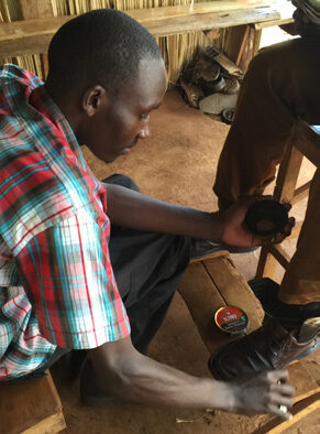 A successful recipient of this project in his shoe shine and repair business. © Diocese of Eldoret,  used with permission.