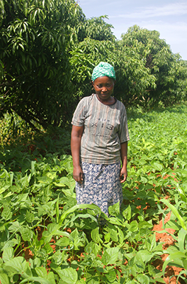Member of the Kalawani CBO with her crops