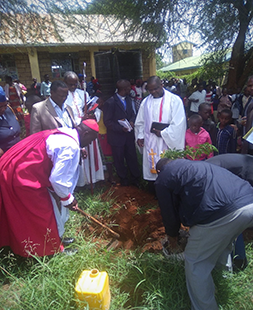 Tree planting by Bishop Francis Matui
