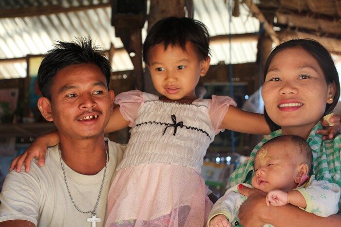 Naing and Win with their daughter from rural Myanmar.