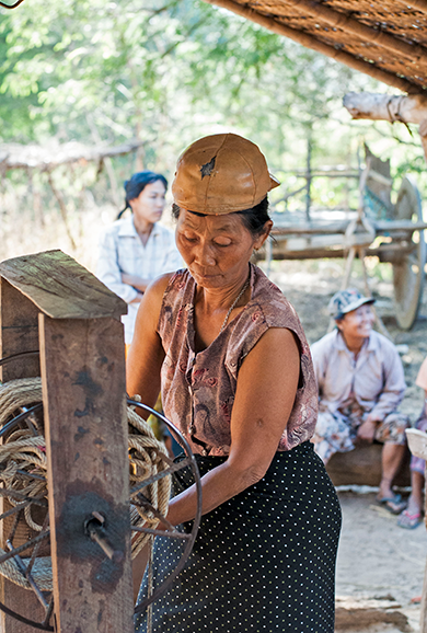 A woman fetches water at Myi Ni Gone village