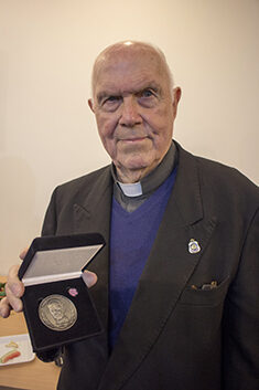 Fr Eric Hampson with the Coaldrake Award