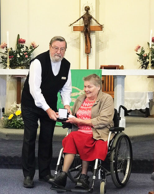 The Rev Joan Pascoe receives her Coaldrake Award from the Rev Ken Spreadborough.