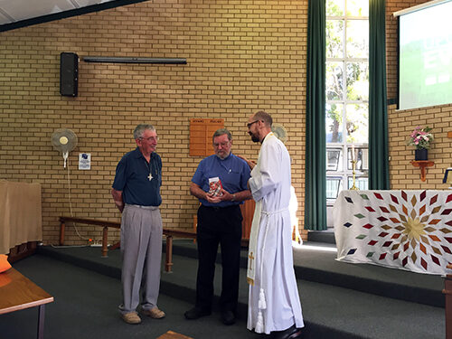 The Rev Brian Hughes receives the Coaldrake Award.