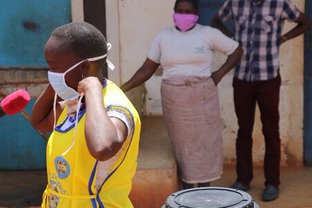 ABM’s partner in Kenya masks up to demonstrate COVID-safe hygiene practices. © Anglican Development Services, Eastern. Used with permission. 