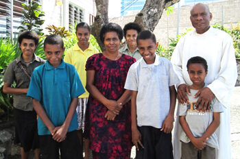 Fr Tennyson Bogar with his wife Eren and children.