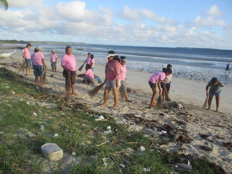 Women cleaning up their local beach: An ABM-funded project in Santa Fe, the Philippines © VIMROD. Used with permission.