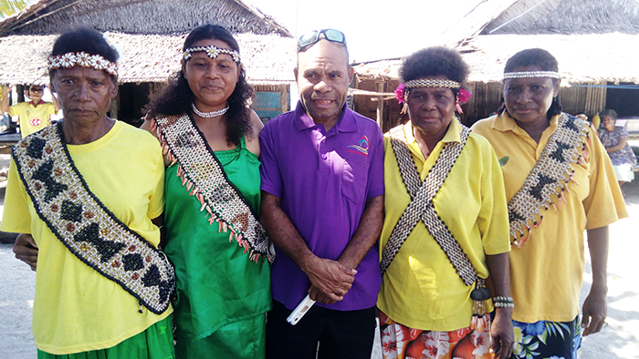 Slade, in green, is now a nationally recognised designer due to assistance from the Church Partnership Program.