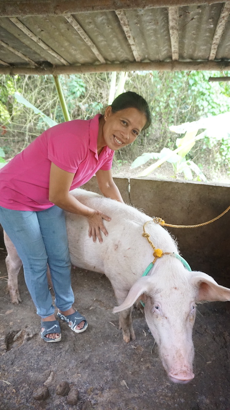 Oliva with one of her pigs