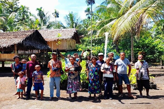 Some of the community members and their chief (middle) © Anglicare PNG. Used with permission.