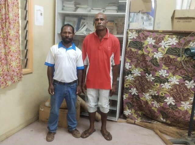 Ahge (R) with his teacher Warren © Anglicare, PNG. Used with permission.