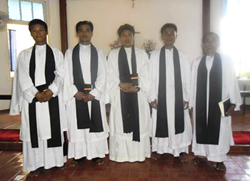 Five newly ordained priests