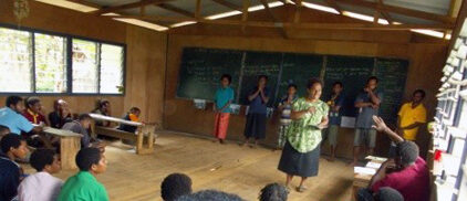 Participants discussing social issues in class at Tsendiap, Jimi Valley, Jiwaka Province.
