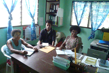 Rachael, Jeffrey and Constance hard at work planning adult literary classes and HIV prevention activities in Dogura Diocese.