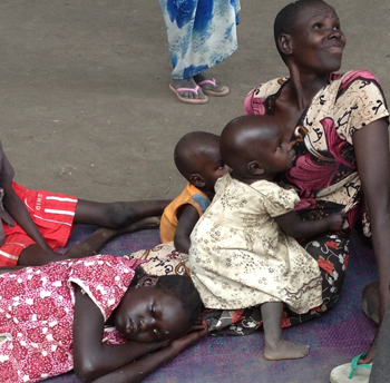 Mother with twin infants to feed in South Sudan. © ECSSS/Rev Emmanuel Lumoro 2014