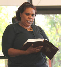 Rita Okai reading Pitjantjatjara Bible at a Nungalinya daily Chapel Service. ©Nungalinya College 2014
