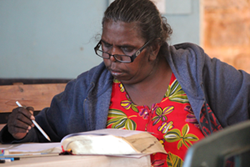 Miriam Numamurdirdi studying the scriptures at a Bishop’s Award Program training event in Ngukurr community, NT. © The Anglican Diocese of the Northern Territory.