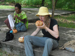 Keeping cool with some coconut juice (Rachael Inuwai, ACPNG Literacy Officer in background)