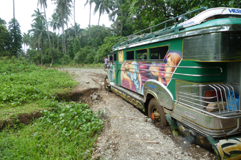 Jeepney trapped in mud.