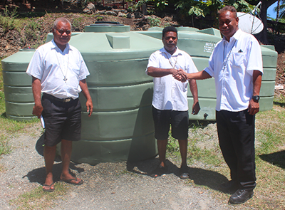 Fr George Elo donating the tanks