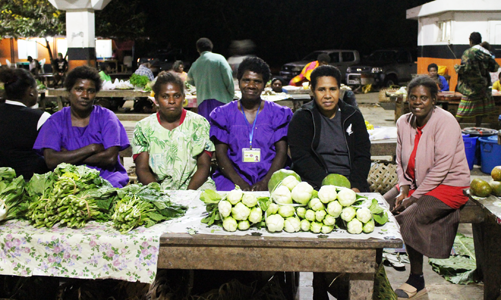 Literacy students from Amnos in Santo who travel to Luganville markets fortnightly to sell produce. Teacher Hilda is on the right. © Kate Winney/ABM, 2017.