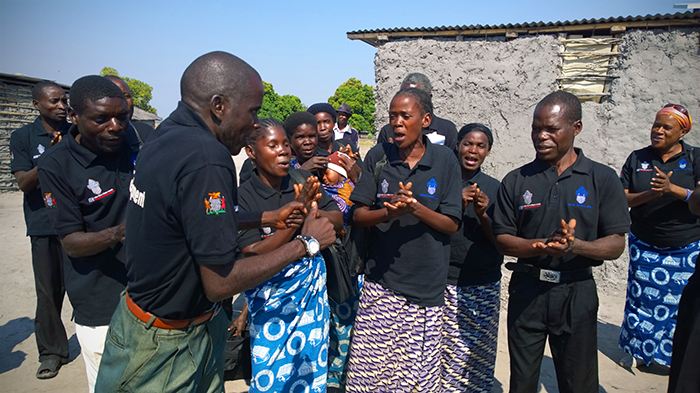 Gender and Governance group sings a welcome